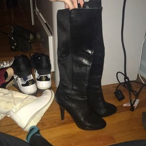 Black heeled high knee boots